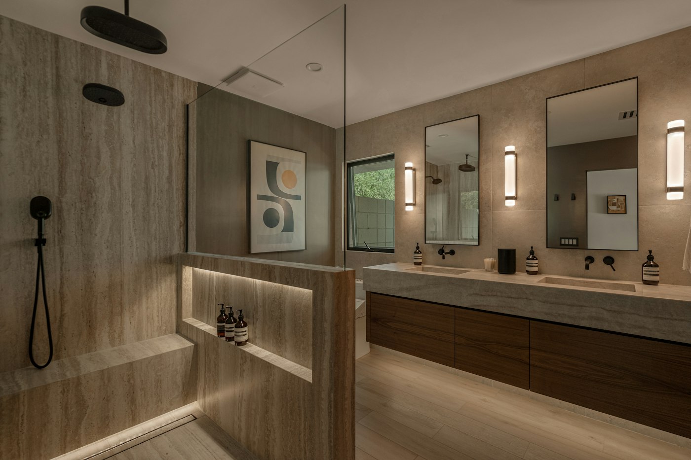 Walk-in shower and double vanity in warm stone